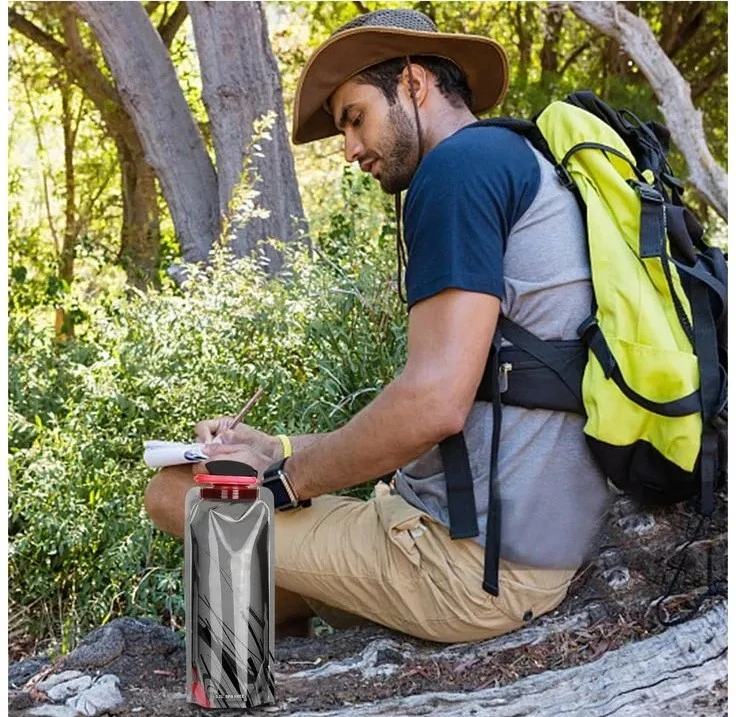 A hiker taking notes in the forest beside a collapsible water bottle—illustrating How Much Water to Bring When Backpacking