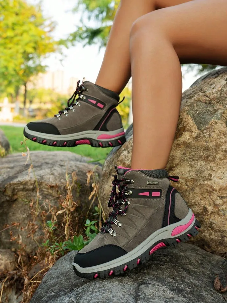 Best Hiking Shoes for Women – stylish and durable high-ankle boots designed for outdoor adventures, shown worn on a rocky trail.
