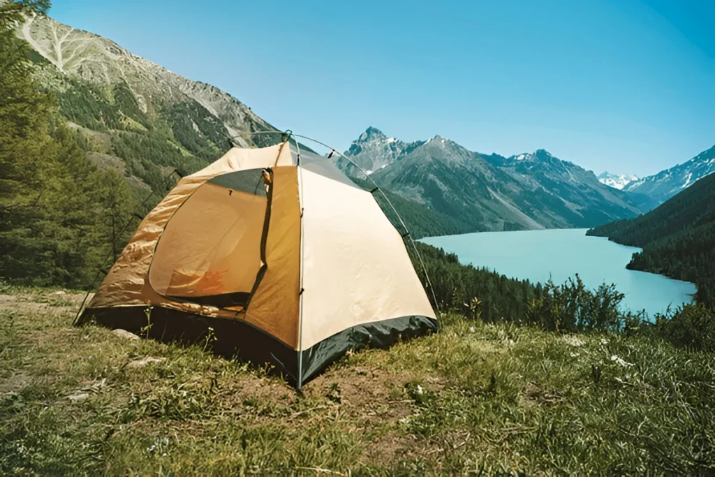 Camping tent with lake background. Beautiful mountain landscape in the Altai mountains. Lake kucherlinskoe. Siberia. Russia