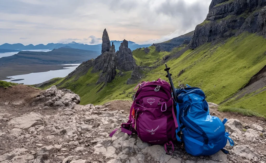 Osprey backpacks resting on the ground