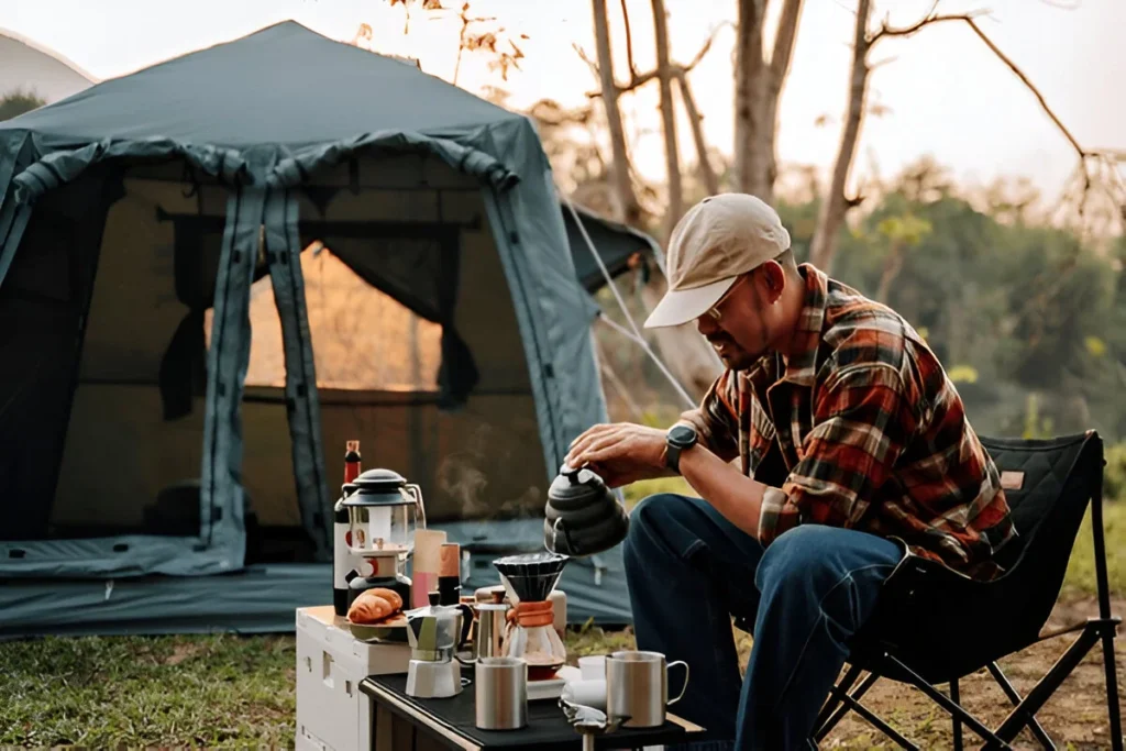 A man drip coffee in the camp