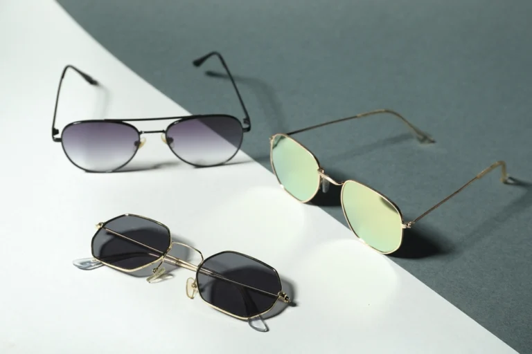 Different stylish best sunglasses on colorful background