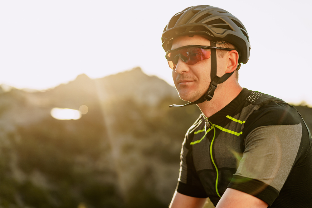 a man driving a cycling with best sunglasses