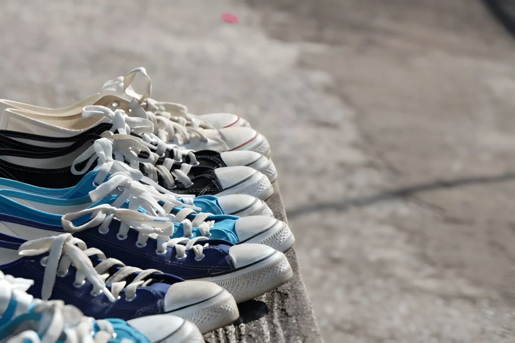 A row of colorful canvas sneakers neatly lined up, representing some of the Best Walking Shoes for everyday comfort.
