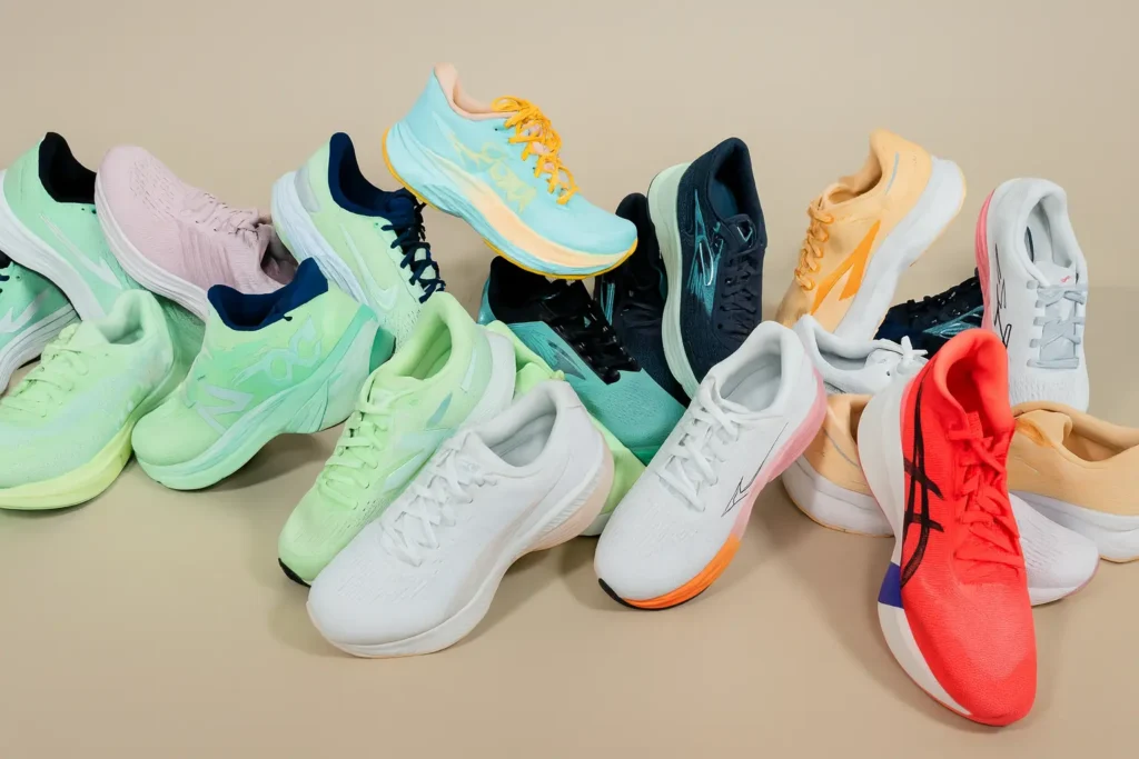 A colorful collection of top-rated athletic shoes arranged on a neutral background, showcasing options for the Best Running Shoes for Women