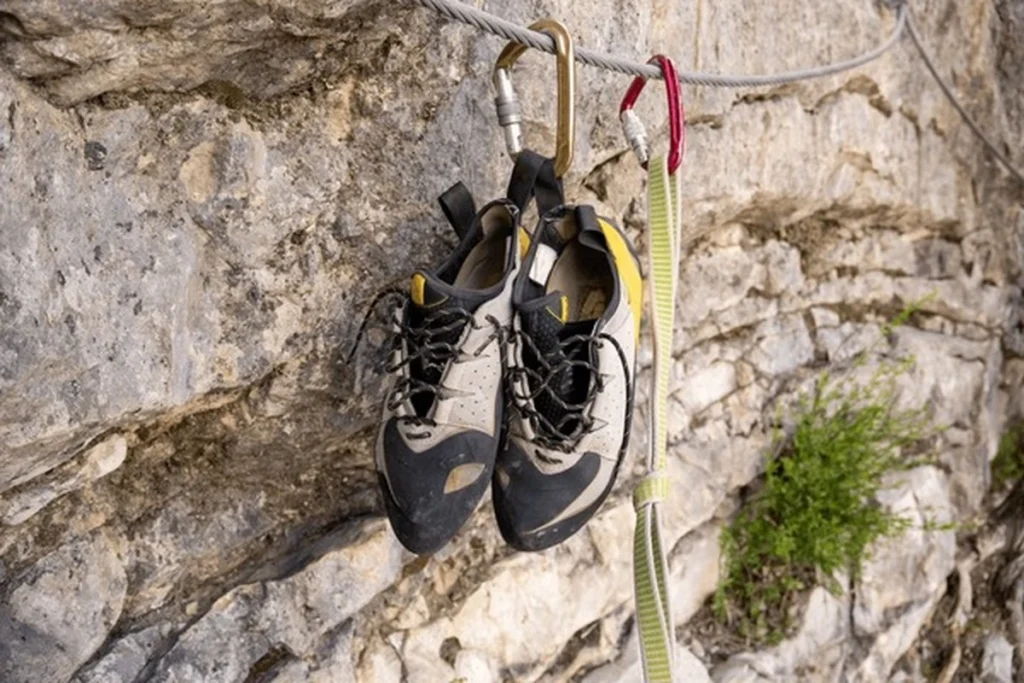 Best Climbing Shoes for Women hanging on a rock wall, designed for excellent grip, durability, and performance during outdoor climbing adventures.