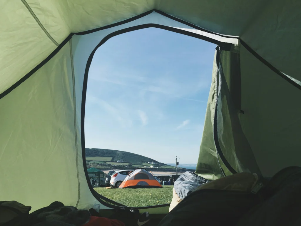 A scenic view from inside a tent overlooking other campsites, perfect for highlighting the Best 4-Season Tents.